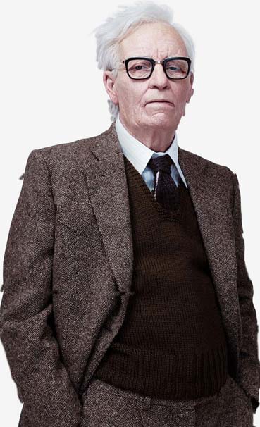 Dr Klemperer stands in an old tweed suit with his hands in his pockets.