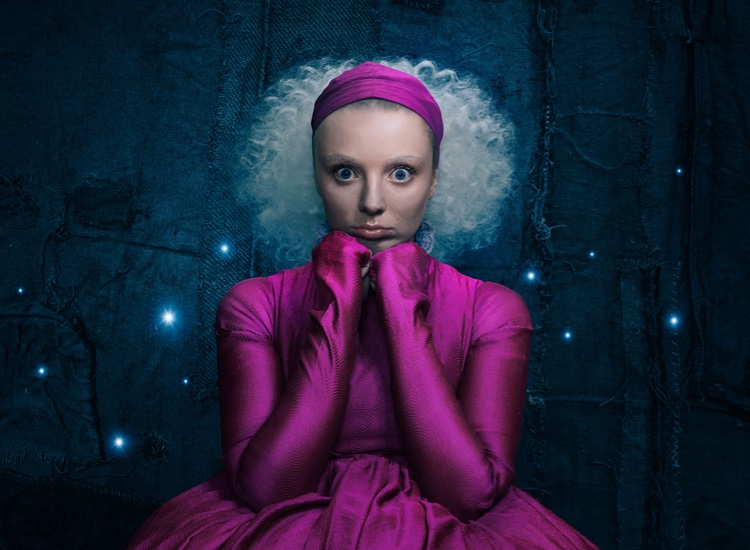 The Hex show image. A photograph of Rose (played by Kat Ronney) wearing a pink dress.